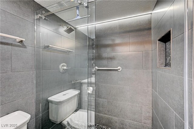 205 E Harmon Ave Unit 1010, Las Vegas, NV 89169 - bathroom featuring toilet and a shower stall