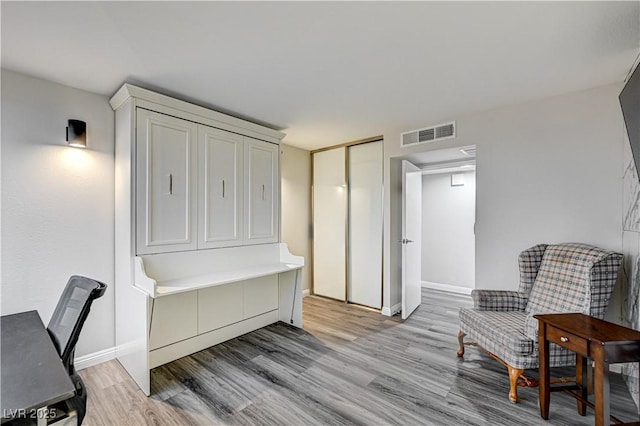 205 E Harmon Ave Unit 1010, Las Vegas, NV 89169 - interior space featuring visible vents, baseboards, and light wood finished floors