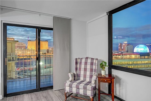205 E Harmon Ave Unit 1010, Las Vegas, NV 89169 - living area with a view of city and wood finished floors