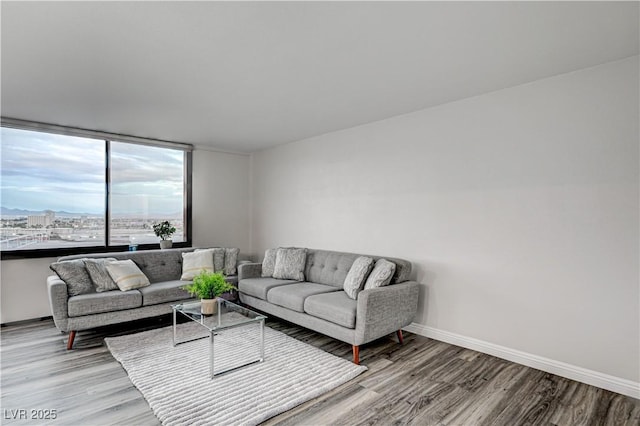 205 E Harmon Ave Unit 1010, Las Vegas, NV 89169 - living room featuring wood finished floors and baseboards