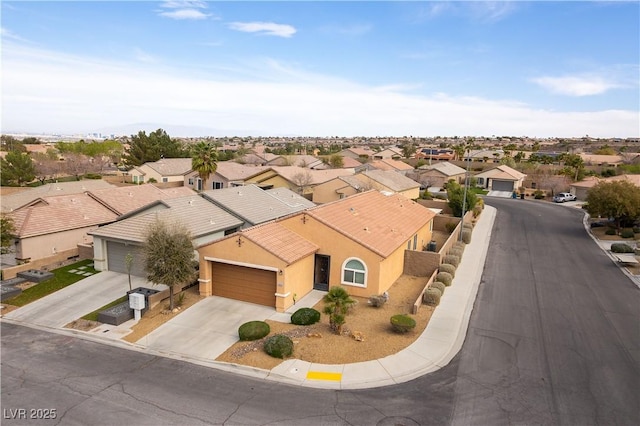 birds eye view of property with a residential view