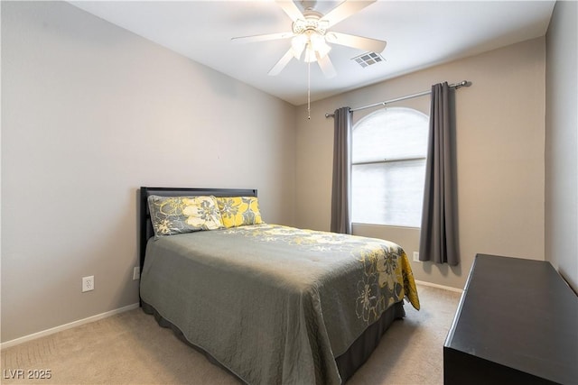 bedroom with light colored carpet, visible vents, and baseboards