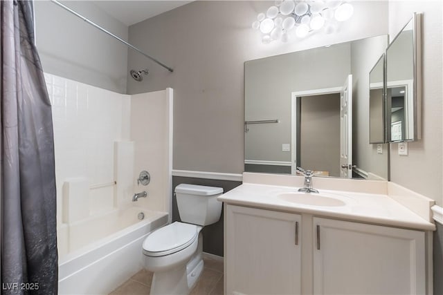 bathroom featuring tile patterned floors, shower / bathtub combination with curtain, toilet, and vanity