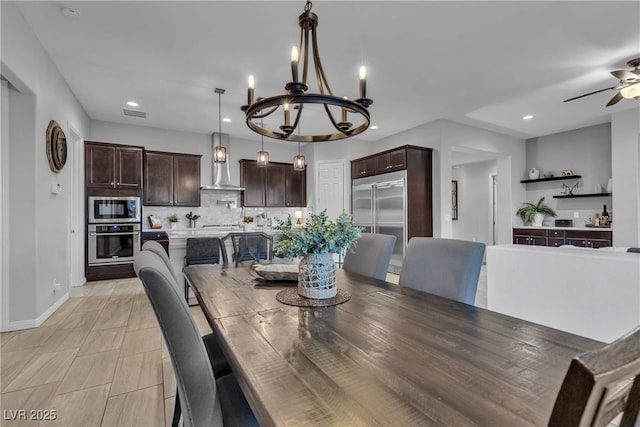 dining space featuring visible vents, baseboards, recessed lighting, ceiling fan with notable chandelier, and light tile patterned flooring