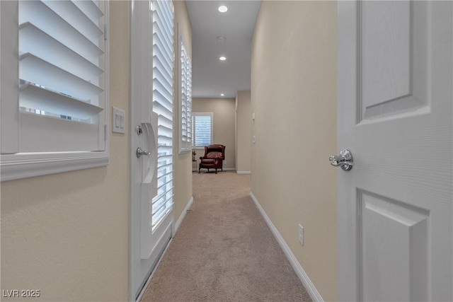 corridor with recessed lighting, baseboards, and carpet