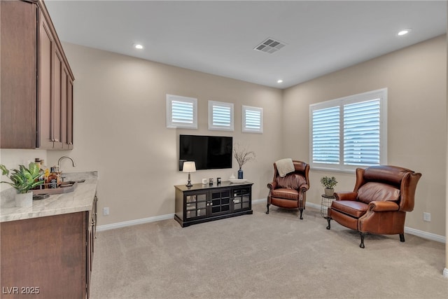 sitting room featuring recessed lighting, baseboards, visible vents, and light carpet