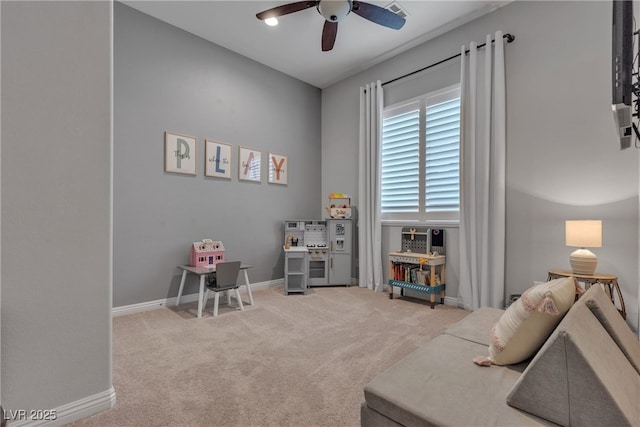 interior space featuring a ceiling fan, baseboards, and carpet floors