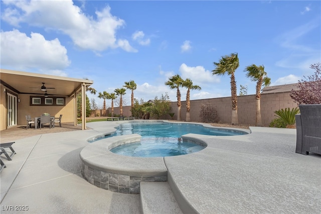 view of pool with a patio, a fenced backyard, a ceiling fan, and a pool with connected hot tub