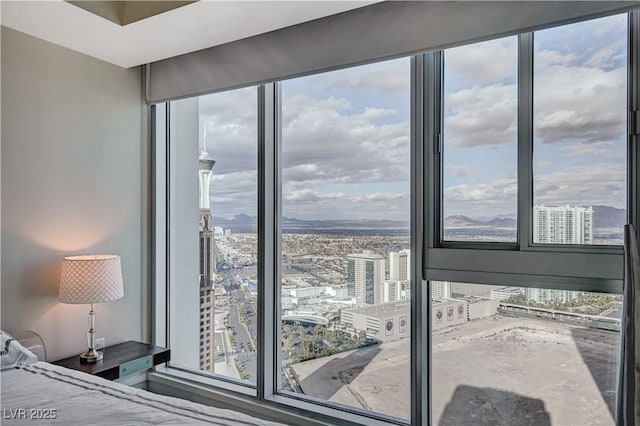 bedroom with a city view