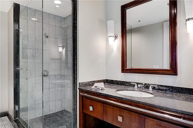 full bath with vanity and a stall shower