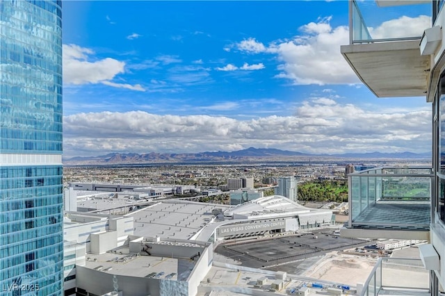 property's view of city with a mountain view