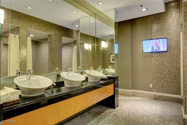 full bathroom with tile patterned floors, recessed lighting, a shower stall, and a sink