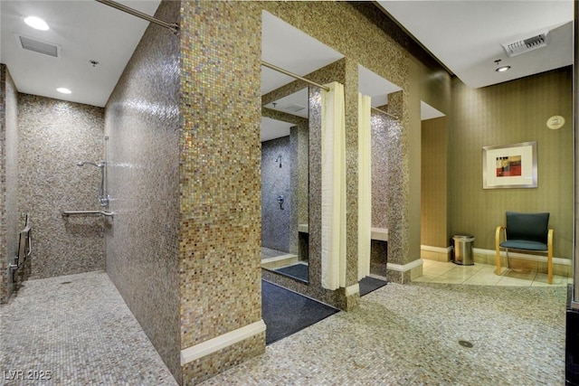 interior space with recessed lighting, visible vents, tiled shower, and tile patterned flooring