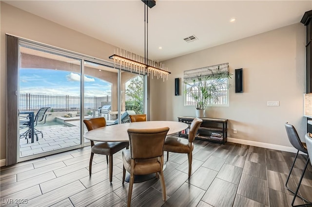 dining space with recessed lighting, baseboards, and visible vents