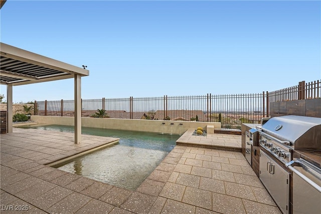 view of patio / terrace featuring exterior kitchen, area for grilling, a fenced backyard, and a fenced in pool