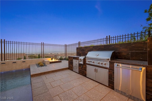 294 Besame Ct, Las Vegas, NV 89138 - patio terrace at dusk with area for grilling, a swimming pool, fence, and a grill