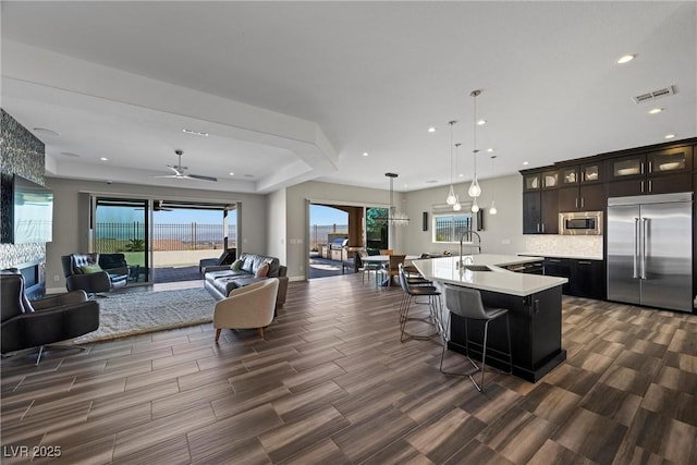 294 Besame Ct, Las Vegas, NV 89138 - kitchen with visible vents, light countertops, built in appliances, and open floor plan