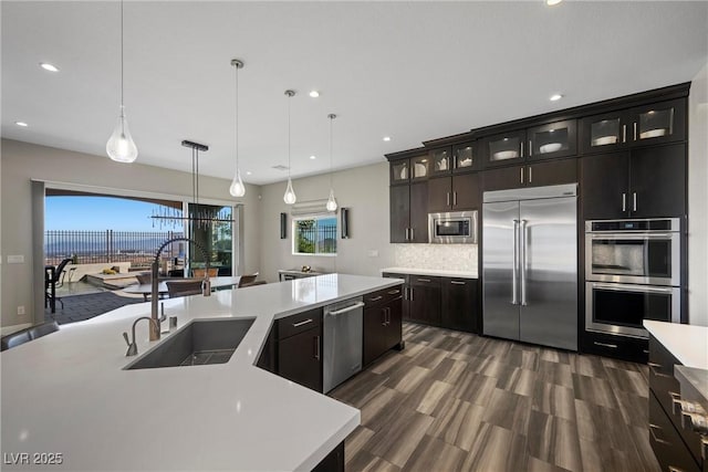 294 Besame Ct, Las Vegas, NV 89138 - kitchen with recessed lighting, a sink, built in appliances, and light countertops