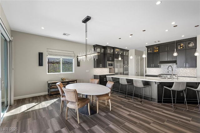 294 Besame Ct, Las Vegas, NV 89138 - dining area featuring recessed lighting, baseboards, dark wood-style floors, and visible vents