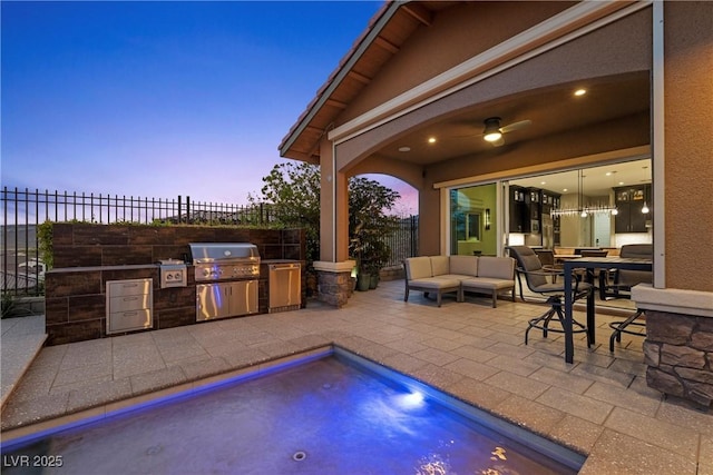 294 Besame Ct, Las Vegas, NV 89138 - view of patio with fence, an outdoor kitchen, grilling area, outdoor lounge area, and a fenced in pool