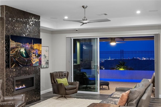 294 Besame Ct, Las Vegas, NV 89138 - living area with visible vents, a ceiling fan, wood finished floors, and a premium fireplace