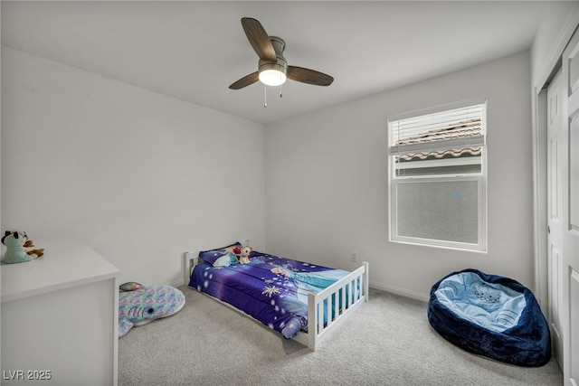 bedroom with baseboards, carpet, and ceiling fan