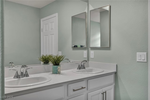 full bath with a sink and double vanity