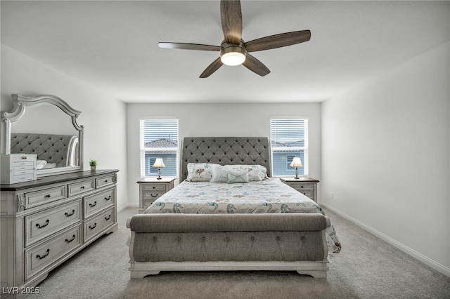carpeted bedroom with multiple windows, baseboards, and ceiling fan