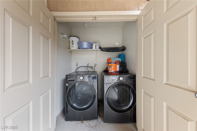 laundry room featuring washer and dryer and laundry area