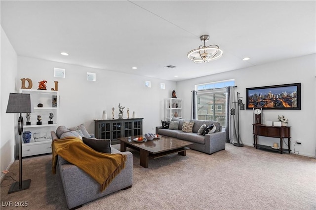 carpeted living room featuring visible vents, recessed lighting, and baseboards