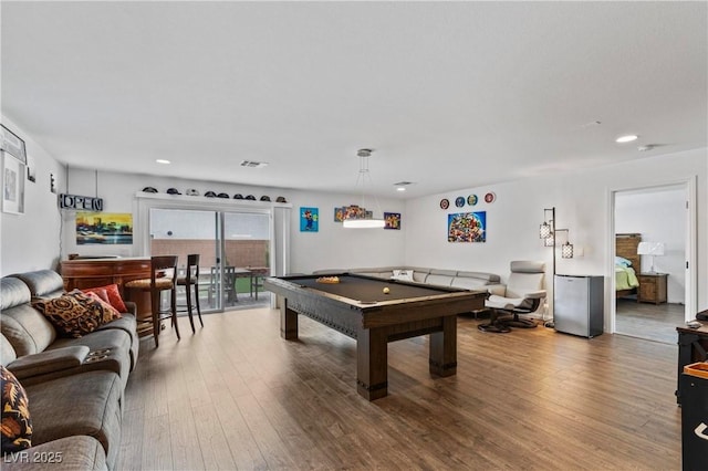 game room with visible vents, pool table, and wood-type flooring