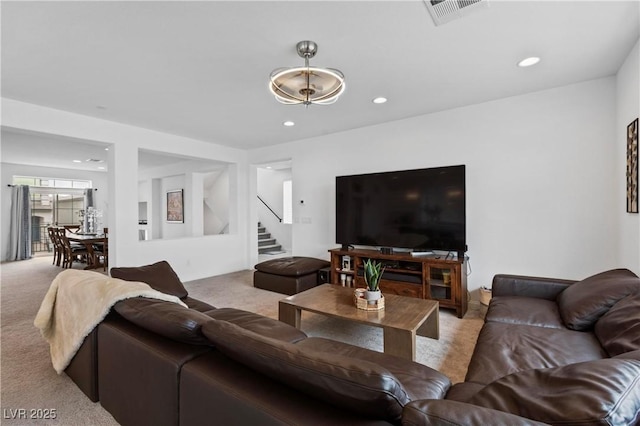 living room featuring stairway, recessed lighting, light colored carpet, and visible vents