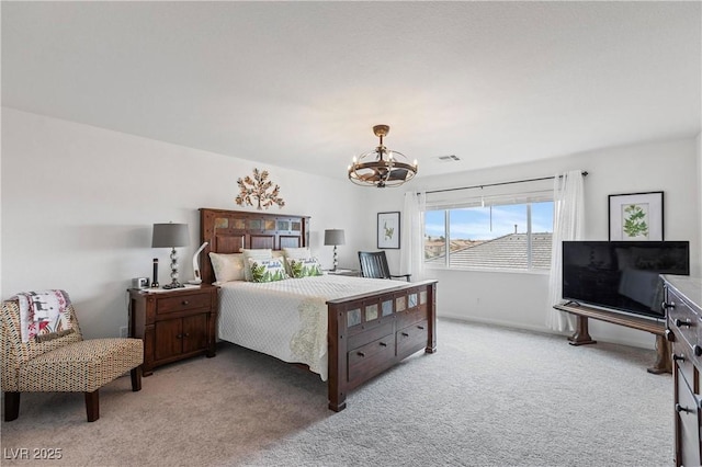 carpeted bedroom with visible vents and a notable chandelier