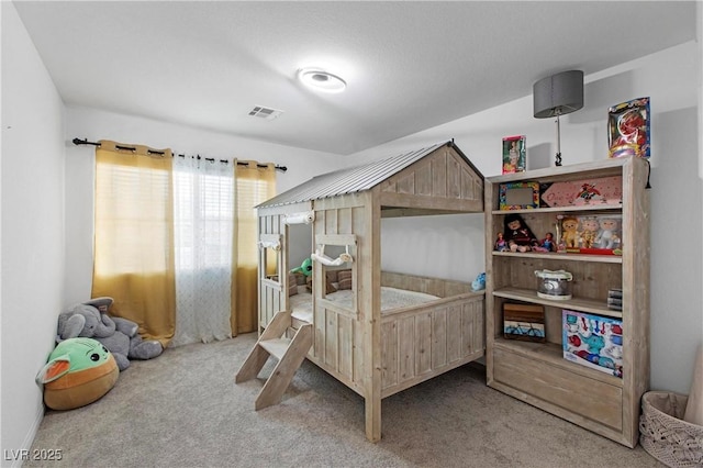 bedroom featuring visible vents and carpet floors