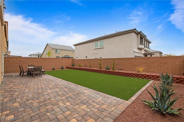 view of yard with a fenced backyard and a patio