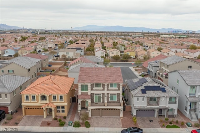 birds eye view of property featuring a mountain view and a residential view