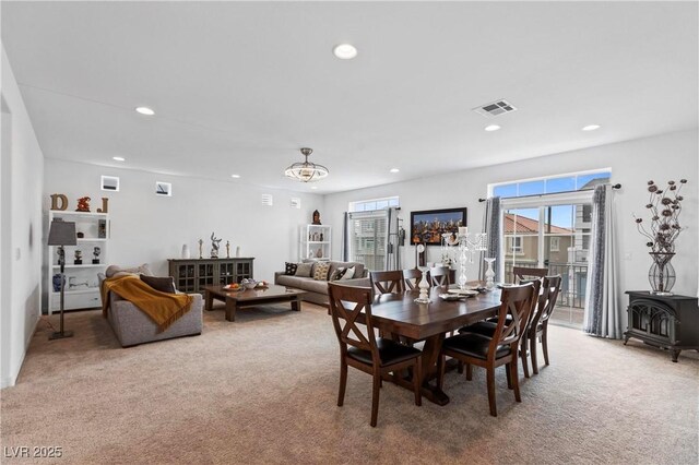 6346 Rock Strm Ln, Las Vegas, NV 89141 - carpeted dining room with a wood stove, a wealth of natural light, and recessed lighting