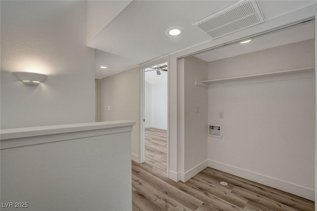 washroom featuring a ceiling fan, hookup for a washing machine, wood finished floors, and visible vents