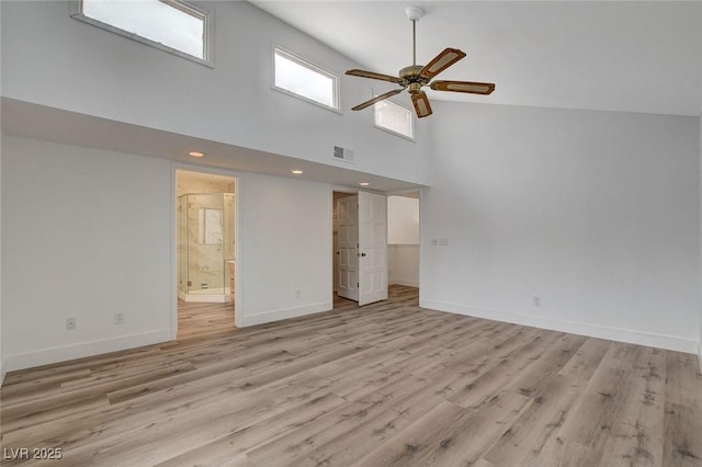 spare room featuring light wood-type flooring, visible vents, baseboards, and ceiling fan