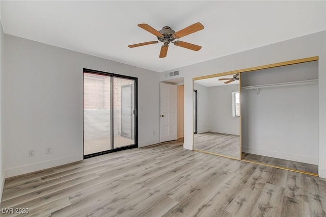 unfurnished bedroom with visible vents, baseboards, wood finished floors, a ceiling fan, and access to outside