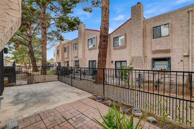 view of patio / terrace featuring fence