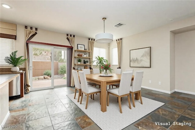 dining space featuring a wealth of natural light, visible vents, recessed lighting, and baseboards