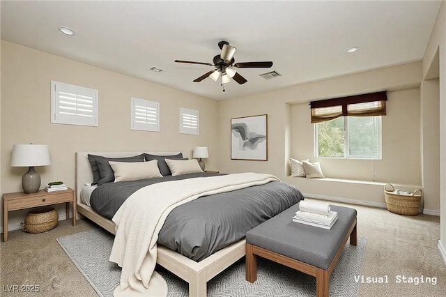 bedroom featuring visible vents, baseboards, carpet, and a ceiling fan