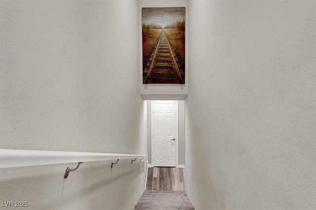 stairs with wood finished floors