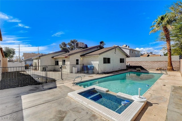 view of swimming pool featuring a patio, central air condition unit, a fenced backyard, and a pool with connected hot tub