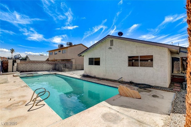 view of pool with a fenced in pool, a patio, and fence