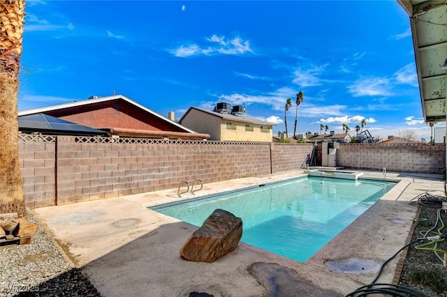 view of pool featuring a fenced in pool, a fenced backyard, and a patio area