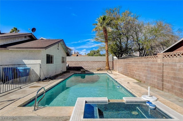 view of pool featuring a patio, a fenced backyard, and a pool with connected hot tub