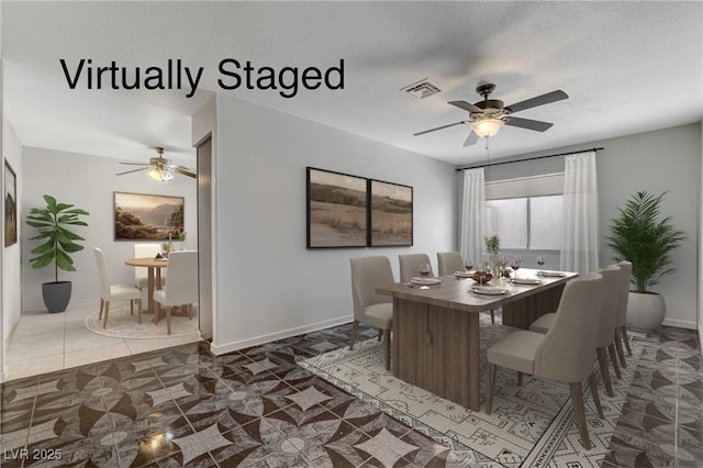 dining space featuring a textured ceiling, a ceiling fan, visible vents, and baseboards