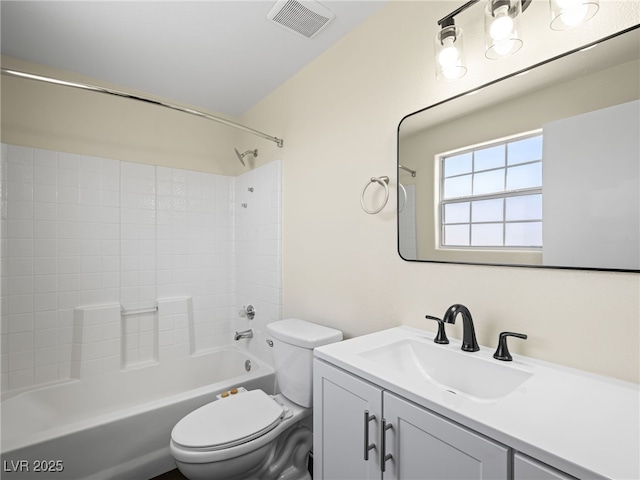 full bathroom with visible vents, toilet, vanity, and bathtub / shower combination